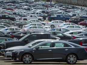 Vehicles are seen in a parking lot at the General Motors Oshawa Assembly Plant in Oshawa, Ont., on Wednesday, June 20, 2018. Industry leaders say the federal Liberal government will face a complex decision, with deep economic consequences, if the U.S. makes good on its threat to slap tariffs on Canadian-made cars and trucks.