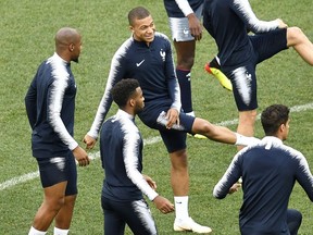 France's Kylian Mbappe exercises with the team during France's official training on the eve of the quarterfinal match between France and Uruguay at the 2018 soccer World Cup at the Nizhny Novgorod Stadium in Nizhny Novgorod, Russia, Thursday, July 5, 2018.