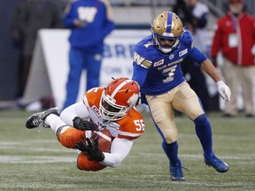 BC Lions' Solomon Elimimian (56) can't hold onto this pass intended for Winnipeg Blue Bombers' Weston Dressler (7) during the second half of CFL action in Winnipeg Saturday, October 28, 2017. There was a bit of divine intervention at play in the B.C. Lions come-from-behind win last weekend, but the team can't count on that happening every week, says coach Wally Buono.