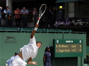 Felix Auger-Aliassime, of Canada, returns to Alex De Minaur, of Australia, during their boy's singles match on day eleven of the Wimbledon Tennis Championships in London, Thursday, July 5, 2016. After bowing out in the second round of qualifying at the French Open, Canada's Felix Auger-Aliassime sat down with his coaches and decided to make a short-term change with a long-term goal in mind.