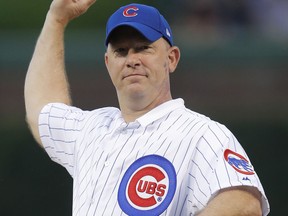 Purdue University football coach Jeff Brohm throws out a ceremonial first pitch before a baseball game between the St. Louis Cardinals and the Chicago Cubs, Saturday, July 21, 2018, in Chicago.