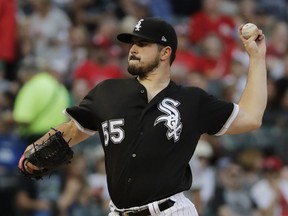 Chicago White Sox starting pitcher Carlos Rodon throws to a St. Louis Cardinals batter during the first inning of baseball game in Chicago, Wednesday, July 11, 2018.