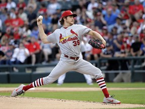 St. Louis Cardinals starting pitcher Miles Mikolas delivers during the first inning of a baseball game against the Chicago White Sox Tuesday, July 10, 2018, in Chicago.