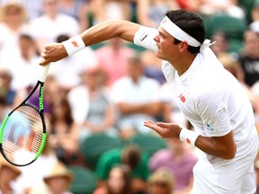 Milos Raonic serves to John Millman at Wimbledon on July 4.