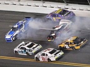 Matt Tifft (2) and Austin Cindric (60) spin after colliding in Turn 1 as Ryan Truex (11), Tyler Reddick (9), Justin Haley (24) and Daniel Hemric (21) try to avoid them during the NASCAR Xfinity Series auto race at Daytona International Speedway Friday, July 6, 2018, in Daytona Beach, Fla.