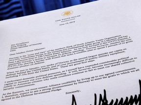 A copy of a letter sent to the Prime Minister Erna Solberg of Norway by U.S. President Donald Trump demanding an increase in Norway's NATO spending is photographed in Washington, Tuesday, July 3, 2018. The letter was supplied to the Associated Press by the Norwegian Defense Ministry.