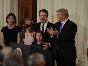 President Donald Trump applauds Judge Brett Kavanaugh his Supreme Court nominee, in the East Room of the White House, Monday, July 9, 2018, in Washington.