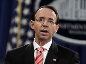 Deputy Attorney General Rod Rosenstein speaks during a news conference at the Department of Justice, Friday, July 13, 2018, in Washington.