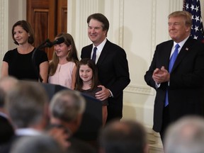 President Donald Trump applauds Judge Brett Kavanaugh his Supreme Court nominee, and his family, in the East Room of the White House, Monday, July 9, 2018, in Washington.