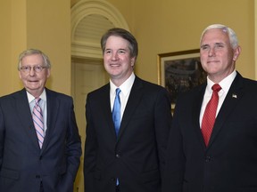 Senate Majority Leader Mitch McConnell of Ky., left, poses for a photo with Supreme Court nominee Brett Kavanaugh, center, and Vice President Mike Pence, right, as they visit Capitol Hill in Washington, Tuesday, July 10, 2018. Kavanaugh is on Capitol Hill to meet with Republican leaders as the battle begins over his nomination to the Supreme Court.