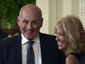 White House chief of staff John Kelly, left, and White House counselor Kellyanne Conway laugh before the start of a news conference with President Donald Trump and Italian Prime Minister Giuseppe Conte in the East Room of the White House in Washington, Monday, July 30, 2018.