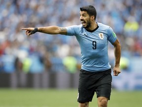 Uruguay's Luis Suarez points during the quarterfinal match between Uruguay and France at the 2018 soccer World Cup in the Nizhny Novgorod Stadium, in Nizhny Novgorod, Russia, Friday, July 6, 2018.