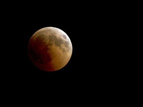 A blood moon rises over Cairo, Friday, July 27, 2018.