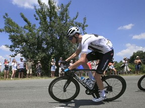 Britain's Chris Froome rides in the pack during the second stage of the Tour de France cycling race over 182.5 kilometers (113.4 miles) with start in Mouilleron-Saint-Germain and finish in La Roche Sur-Yon, France, Sunday, July 8, 2018.