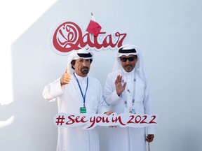 Two men pose for a picture in the Majlis Qatar pavilion in Gorky Park at the World Cup in Moscow on July 12.