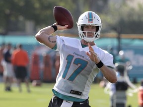 Miami Dolphins quarterback Ryan Tannehill (17) throws a pass at the NFL football team's training camp, Thursday, July 26, 2018, in Davie, Fla.