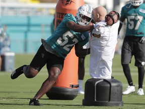 Miami Dolphins linebacker Raekwon McMillan (52) does drills at the NFL football team's training camp, Friday, July 27, 2018, in Davie, Fla.