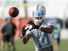 Miami Dolphins wide receiver Kenny Stills (10) does drills Thursday, July 26, 2018, at the NFL football team's training camp in Davie, Fla.