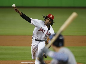 Miami Marlins' Jose Urena delivers a pitch to Tampa Bay Rays' Jake Bauers during the first inning of a baseball game, Wednesday, July 4, 2018, in Miami.