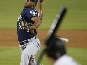 Milwaukee Brewers' Freddy Peralta pitches to Miami Marlins' Derek Dietrich during the first inning of a baseball game Wednesday, July 11, 2018, in Miami.