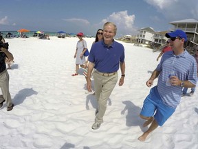 Sen. Bill Nelson walks onto the sand in South Walton County at a public beach access to hold a press conference about customary use of beaches in Walton County Friday, July 27, 2018, in Santa Rosa Beach, Fla. Nelson is blasting Florida Gov. Rick Scott for signing a bill that voided a Panhandle county's ordinance that allowed the public to use otherwise privately-owned beaches. When the law went into effect July 1, it voided Walton County's beach use ordinance.
