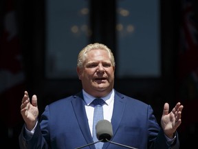 Doug Ford, Ontario's premier, speaks on the front steps of Queens Park Legislature after a swearing-in ceremony in Toronto, Ontario, Canada, on Friday, June 29, 2018.