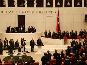 Turkey's President Recep Tayyip Erdogan is applauded by lawmakers at the parliament in Ankara, Turkey, Monday, July 9, 2018 when taking the oath of office for his second term as president.