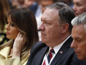 U.S. First Lady Melania Trump, left, and U.S. Secretary of State Mike Pompeo listen to a press conference after the meeting of U.S. President Donald Trump and Russian President Vladimir Putin at the Presidential Palace in Helsinki, Finland, Monday, July 16, 2018.