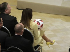 U.S. First Lady Melania Trump holds a soccer ball during a press conference after the meeting of U.S. President Donald Trump and Russian President Vladimir Putin at the Presidential Palace in Helsinki, Finland, Monday, July 16, 2018.