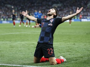Croatia's Josip Pivaric celebrates after his team advanced to the final during the semifinal match between Croatia and England at the 2018 soccer World Cup in the Luzhniki Stadium in Moscow, Russia, Wednesday, July 11, 2018.