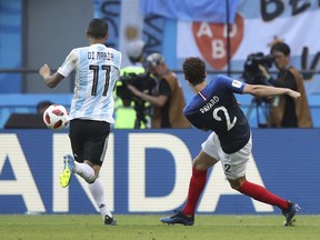 FILE - In this  Saturday, June 30, 2018 filer, France's Benjamin Pavard scores his side' second goal during the round of 16 match between France and Argentina, at the 2018 soccer World Cup at the Kazan Arena in Kazan, Russia. Benjamin Pavard has beaten Juan Quintero into second place in a fans' online vote to pick the best goal of the World Cup. France defender Pavard's spinning right-foot shot against Argentina in the round of 16 came top out of 18 candidates for the award. FIFA says more than three million votes were logged on its website.