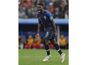 France's Samuel Umtiti celebrates at the end of the semifinal match between France and Belgium at the 2018 soccer World Cup in the St. Petersburg Stadium, in St. Petersburg, Russia, Tuesday, July 10, 2018. France won 1-0.