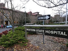 FILE - In this Nov. 18, 2015, file photo, a sign is posted near an entrance to Western State Hospital in Lakewood, Wash. Hundreds of mentally ill patients at Washington state's largest psychiatric hospital are forced to live in conditions that do not meet federal health and safety standards, while overworked nurses and psychiatrists say they must navigate a management system that punishes whistleblowers.