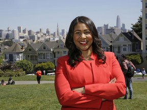 FILE - In this file photo taken April 13, 2018, then San Francisco mayoral candidate and Board of Supervisors President London Breed poses for a photo at Alamo Square in San Francisco. Breed, who will make history as the first African American woman mayor of San Francisco when she takes the oath of office Wednesday, July 11, 2018. The 43-year-old city native who grew up in public housing inherits a city battling entrenched homelessness, open drug use and unbearably high housing costs.