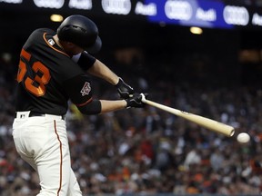San Francisco Giants' Austin Slater drives in a run with a single against the Oakland Athletics during the fourth inning of a baseball game Saturday, July 14, 2018, in San Francisco.