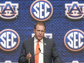 NCAA college football head coach Gus Malzahn of Auburn speaks during the Southeastern Conference Media Days at the College Football Hall of Fame in Atlanta, Thursday, July 19, 2018.