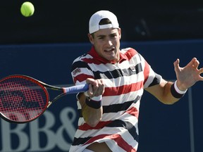 John Isner hits against Ryan Harrison during the finals of the BB&T Atlanta Open tennis tournament Sunday, July 29, 2018, in Atlanta.