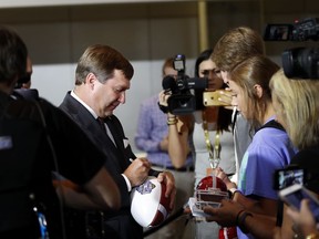 Georgia head coach Kirby Smarts signs autographs as he arrives for Southeastern Conference Media Days Tuesday, July 17, 2018, in Atlanta.