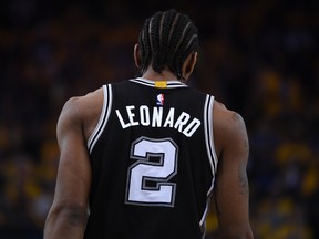 In this May 14, 2017 file photo, San Antonio Spurs forward Kawhi Leonard stands on the court during a playoff game against the Golden State Warriors.