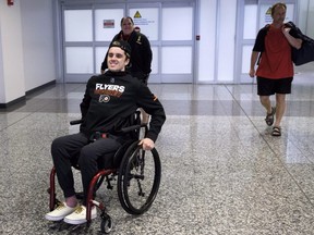 Ryan Straschnitzki and his family return to Calgary from his medical treatment in Philadelphia on Wednesday, July 4, 2018.