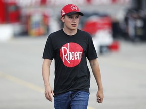 Christopher Bell walks through the garage area before practice for the NASCAR Xfinity Series auto race, Friday, July 27, 2018, at Iowa Speedway in Newton, Iowa.