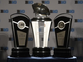 Big Ten Conference trophies sit on stage before the Big Ten NCAA college football Media Days in Chicago, Monday, July 23, 2018.