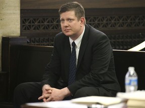 In this May 4, 2018 Chicago police Officer Jason Van Dyke attends a hearing for the shooting death of Laquan McDonald at the Leighton Criminal Court Building, in Chicago. Van Dyke, charged with murder in the fatal shooting of the black teenager will stand trial starting Sept. 5. Cook County Judge Vincent Gaughan's ruling Tuesday, July 17, 2018, comes more than 2 ½ years after Van Dyke was charged with first-degree murder in the 2014 shooting of the 17-year-old on the city's southwest side.