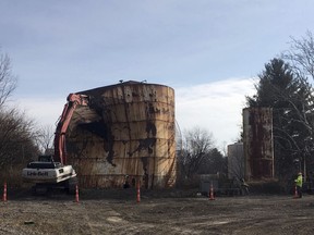 In this Dec. 11, 2017, photo, a tank at a Kiel Bros. facility is torn down in Indianapolis. The collapse of Kiel Bros. Oil Co. in 2004 was widely publicized. Less known is that the state of Indiana and, to a smaller extent, Kentucky and Illinois, are still on the hook for millions of dollars to clean up more than 85 contaminated sites across the three states, including underground tanks that leaked toxic chemicals into soil, streams and wells.