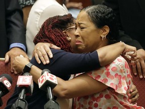 Lisa Berry, right, is comforted by Kyrie Rose following a news conference regarding the July 19 duck boat accident, Tuesday, July 31, 2018, in Indianapolis. A second lawsuit has been filed by members of an Indiana family who lost nine relatives when a tourist boat sank this month in Missouri. The federal lawsuit was filed Tuesday in Missouri on behalf of the estates of two members of the Coleman family. They were among 17 people killed in the July 19 sinking near Branson.