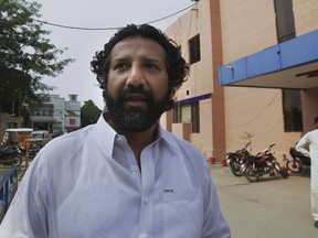 Freed Norwegian journalist Kadafi Zaman leaves a hospital after a medical checkup, in Gujrat, Pakistan, Tuesday, July 17, 2018. Pakistani police said Zaman who was arrested last week during clashes between police and supporters of ex-premier Nawaz Sharif has been freed on bail.
