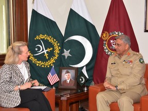 In this Tuesday, July 3, 2018 photo, released by the Pakistani Inter Services Public Relation Department, U.S. deputy assistant secretary of state,  Alice Wells, meets with Pakistani army chief Gen. Qamar Javed Bajwa to discuss how to ensure peace in Afghanistan following a recent cease-fire between the Taliban and Kabul, in Rawalpindi, Pakistan. Pakistan is believed to have played a role in ensuring the first truce in Afghanistan's brutal 17-year war when Kabul and insurgents separately but peacefully celebrated the Muslim feast of Eid al-Fitr. However, violence has later resumed. (Inter Services Public Relation Department, via AP)