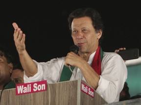 Pakistani politician Imran Khan, chief of Pakistan Tehreek-e-Insaf party, addresses supporters during an election campaign in Lahore, Pakistan, Wednesday, July 18, 2018. Pakistan will hold general election on July 25.