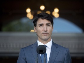 Prime Minister Justin Trudeau speaks during a press conference following a swearing in ceremony at Rideau Hall in Ottawa on Wednesday, July 18, 2018. The federal Liberals certainly can push ahead with their threat to "backstop" unco-operative provinces, which is a polite word for imposing a federal tax against the popular will. But doing so during an election year cannot be an appealing prospect.