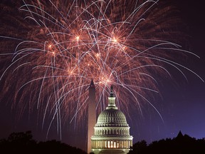 Fireworks explode over the U.S. Capitol and the Washington Monument on Independence Day, July 4, 2018, in Washington, D.C.